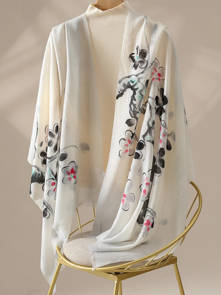 Lightweight black floral wool scarf styled in a long elegant drape