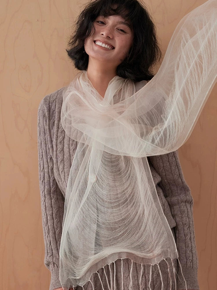 Wheat white mulberry silk scarf styled as a flowing shoulder wrap with fringe