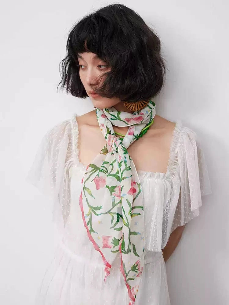 White morning glory silk georgette scarf worn with an elegant white outfit
