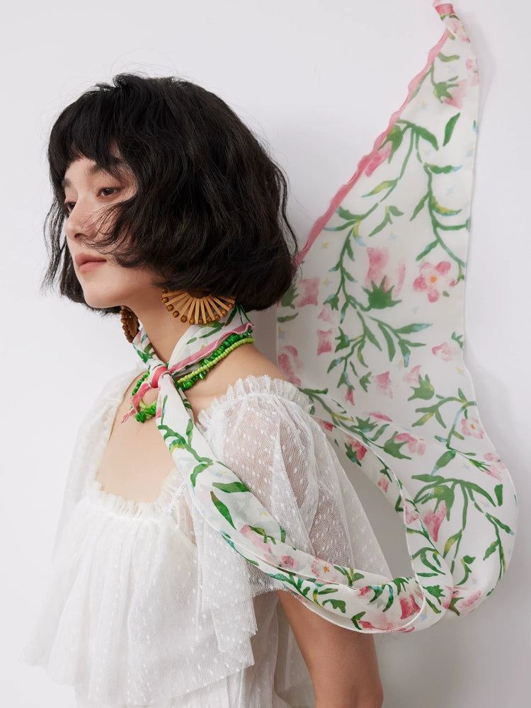 White morning glory skinny silk scarf styled as a sheer silk neck tie