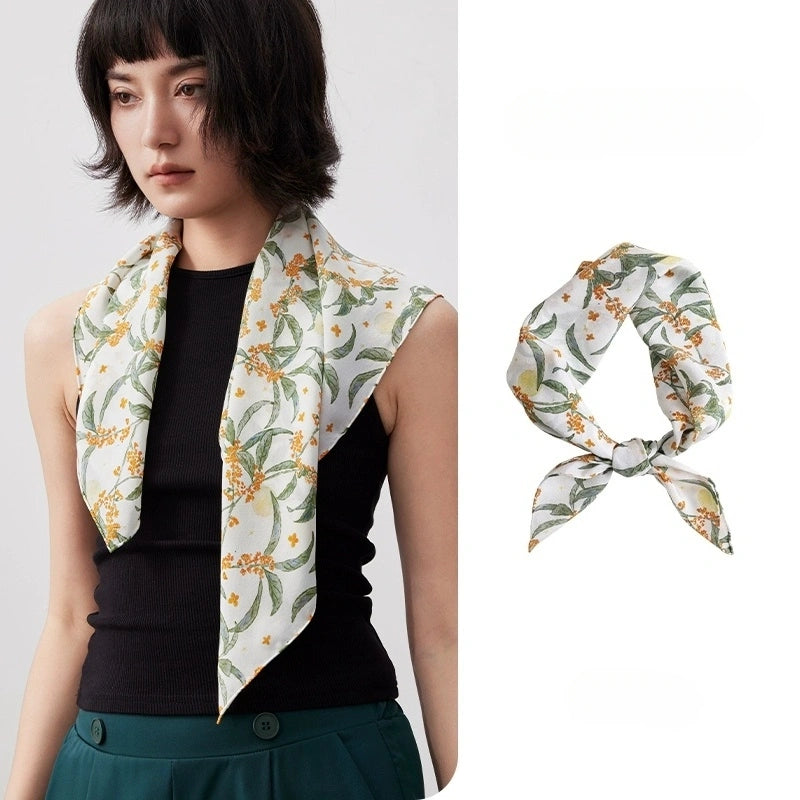 Elegant white osmanthus print silk square scarf, made from 100% mulberry silk, showcases its vibrant floral design and smooth texture.
