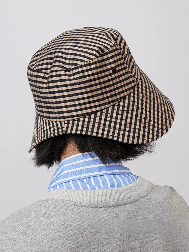 Side rear view of women's black coffee plaid wide brim bucket hat with open back