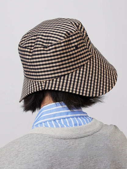 Side rear view of women's black coffee plaid wide brim bucket hat with open back