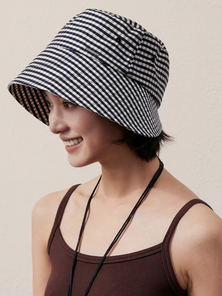 Black and white plaid sun hat for women with wide brim and relaxed vintage styling