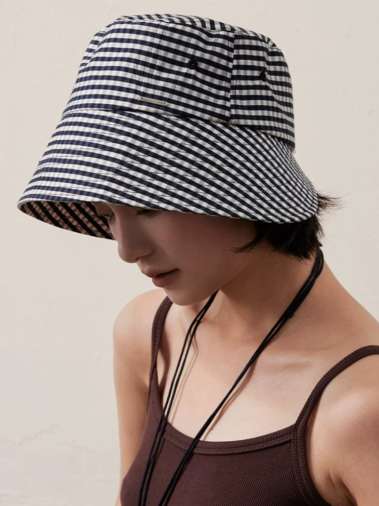 Women's black and white plaid bucket hat with wide brim for everyday summer wear