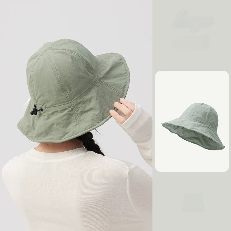 Rear view of a sage green wide brim bucket hat with a drawstring adjuster and a matching product inset.