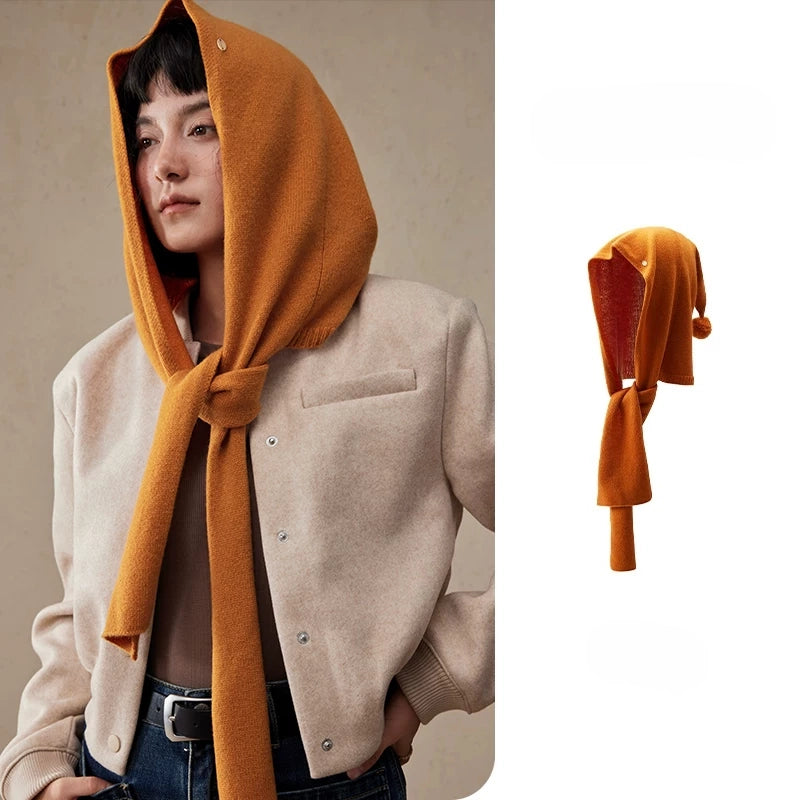 Women's burnt orange wool hooded scarf styled with a beige blazer, with product detail view