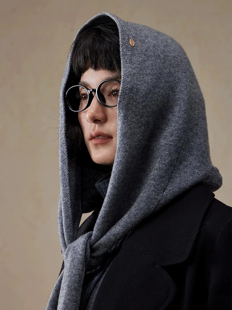 Close-up of woman wearing a dark grey wool hooded scarf with hood up