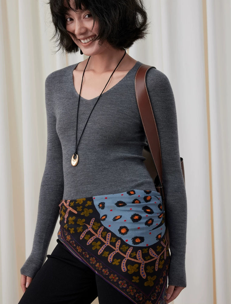 Woman styling a woodland brown leopard floral silk scarf as an elegant waist and hip accent
