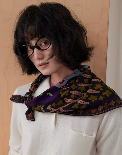Woman wearing a woodland brown and plum mulberry silk scarf draped across her shoulders