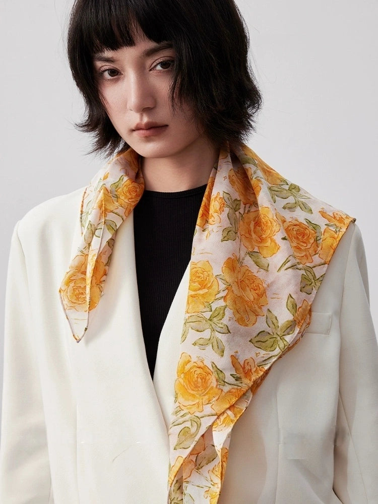 Yellow rose silk square scarf styled as a chic neck accessory, demonstrating its elegance and versatility.
