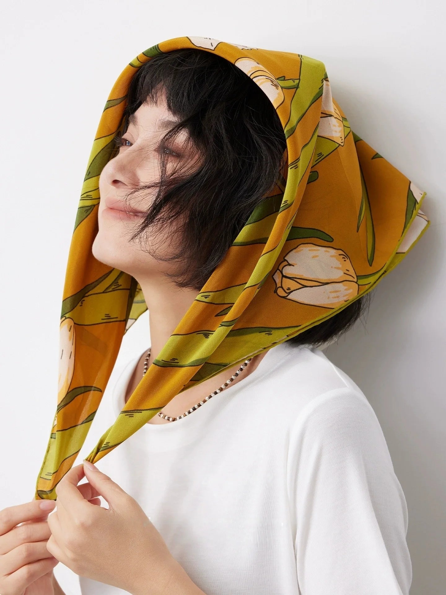 Yellow tulip floral silk scarf styled as a head scarf with a white top